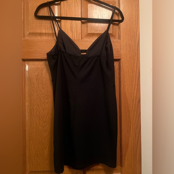 Black mini dress with 3 silver shiny on v neck. Size 4, stretchy material - Picture 3 of 3